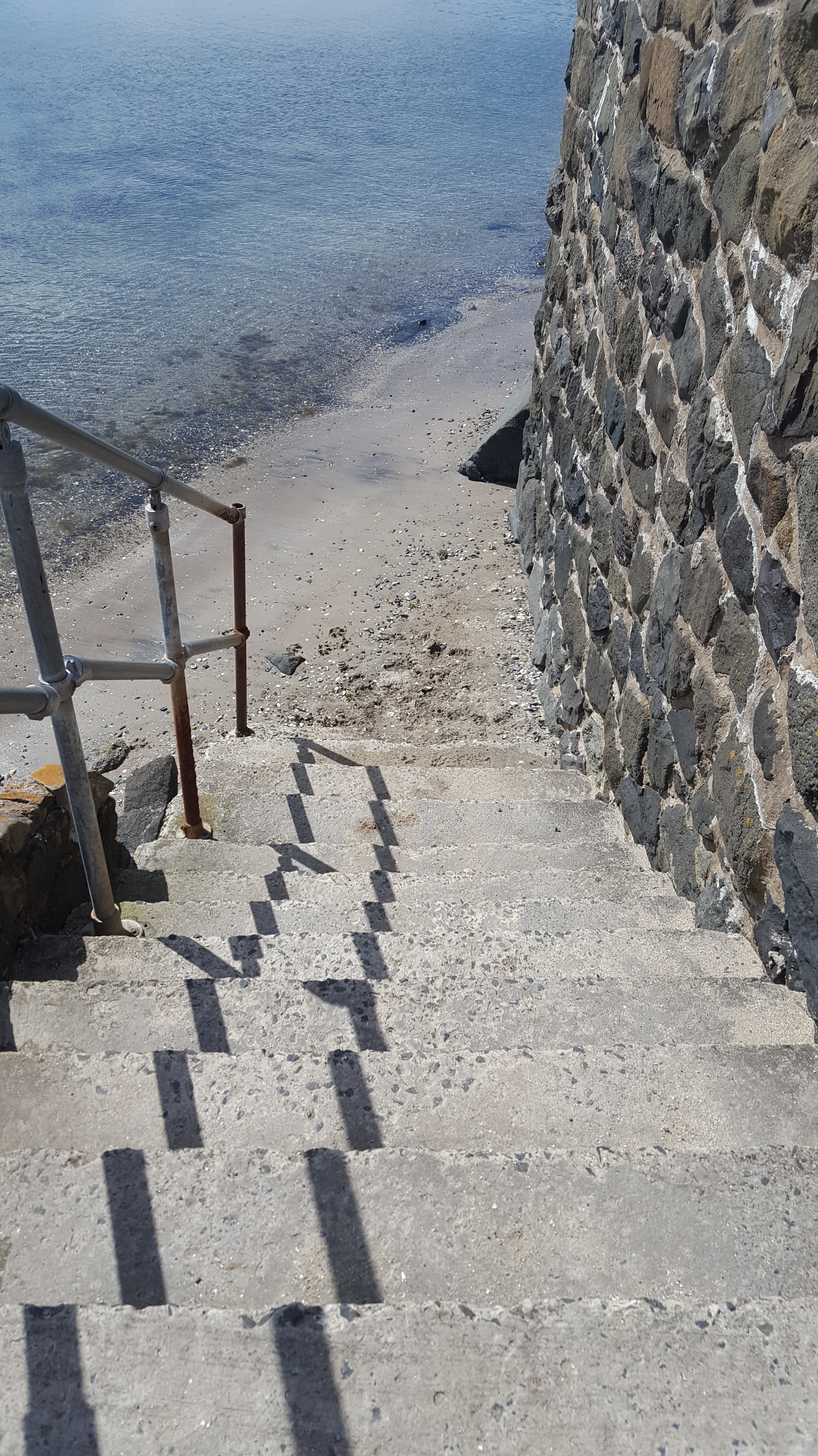 a set of steps leading down to the shore at Hazelbank