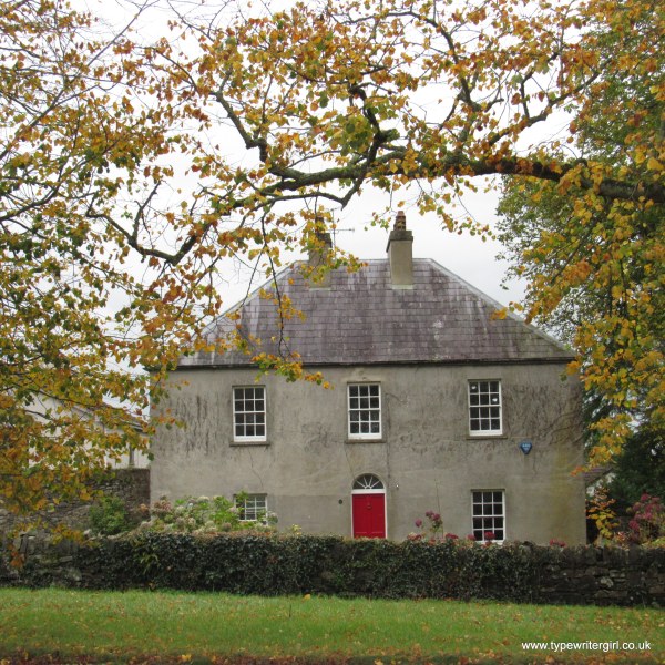 a Georgian house with a red door in Seaforde village